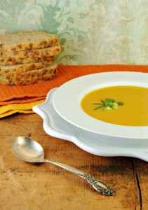 Squash Soup in White Bowl with Bread