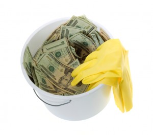 Twenty Dollar Bills in White Cleaning Bucket with latex gloves